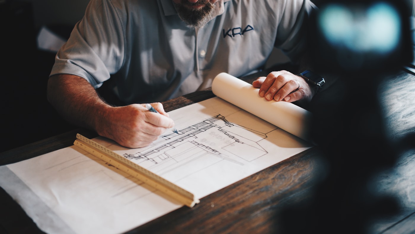 Construction blueprints and drafting tools on a work table