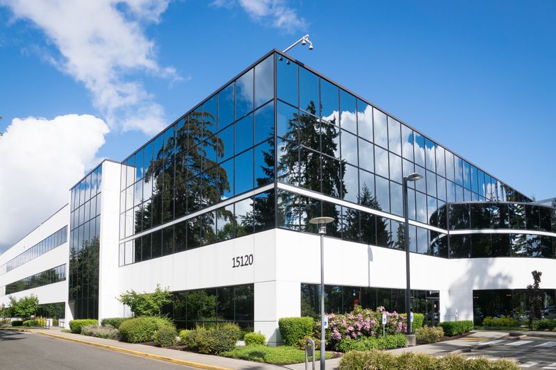 Exterior of a modern industrial building at dusk