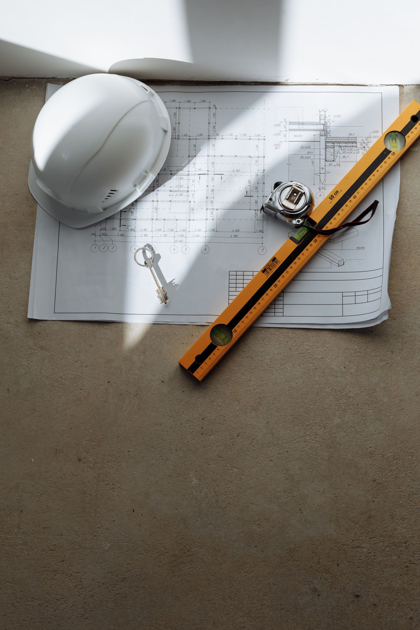 Project team reviewing construction plans around a table