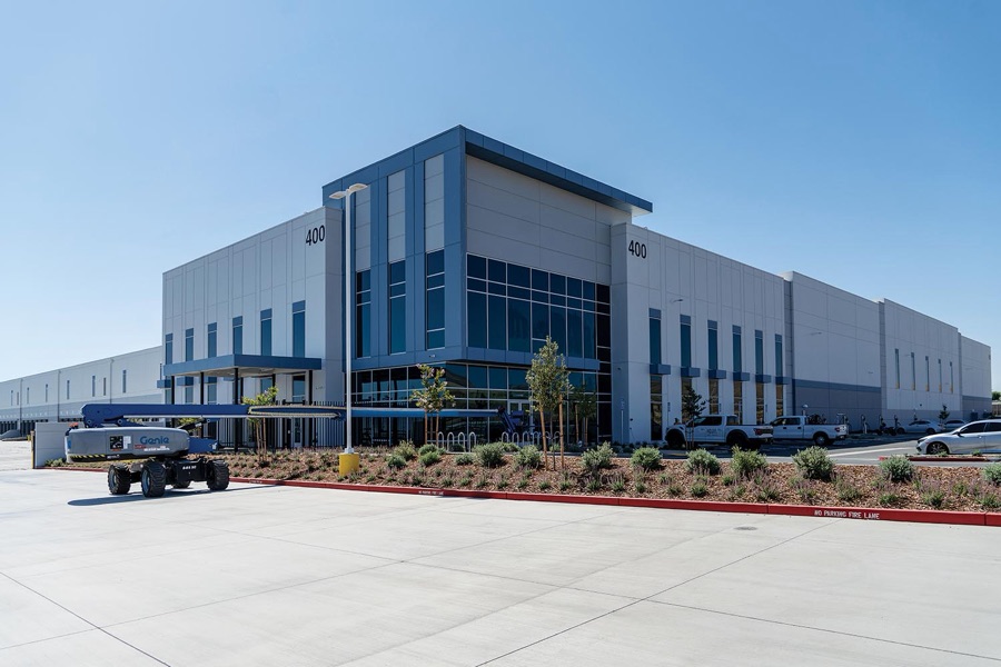 Exterior of a large concrete tilt-up distribution center in Patterson, California