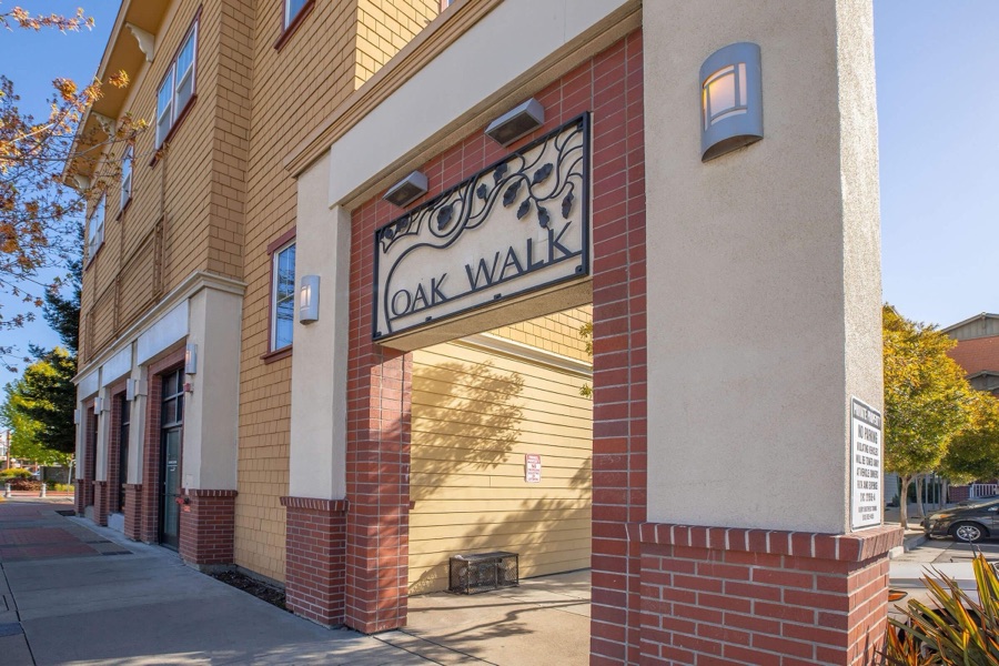 Street entrance of the Oak Walk apartment community in Emeryville
