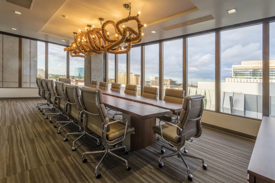 Executive boardroom with floor-to-ceiling windows overlooking downtown Sacramento