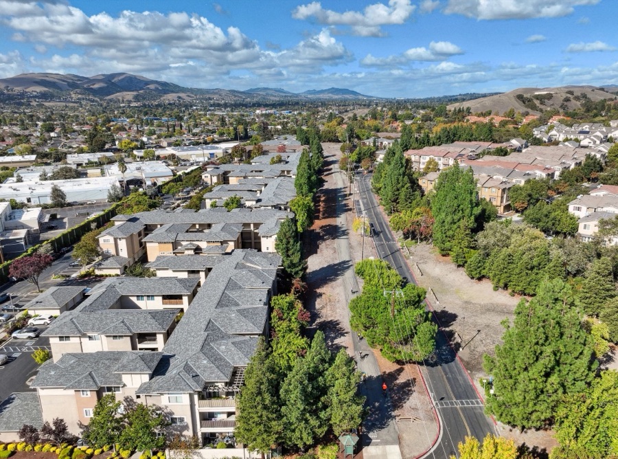 Aerial view of a garden-style apartment community beside the Iron Horse Trail in Dublin