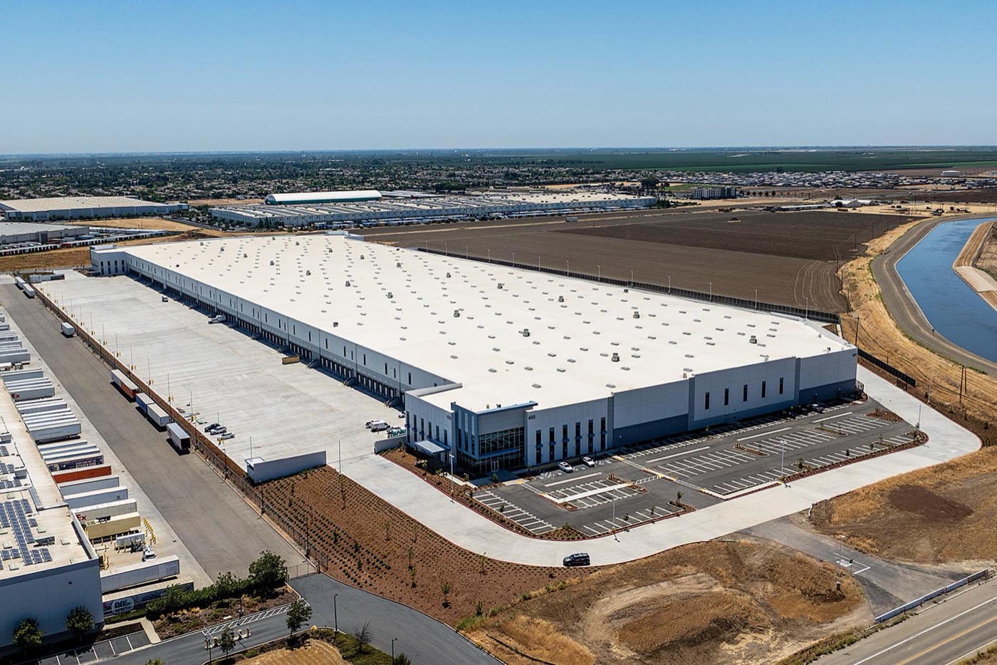 Aerial view of a large tilt-up distribution center in California's Central Valley